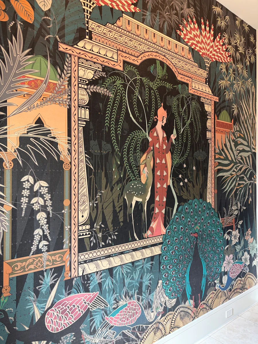Intricate decorative wallcovering with colorful botanical and architectural details